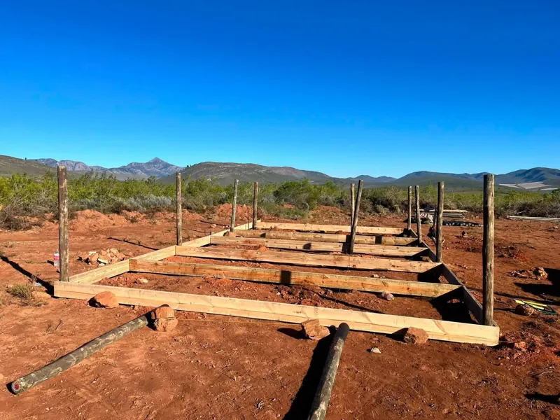 Timber foundation and poles for a Nutec house