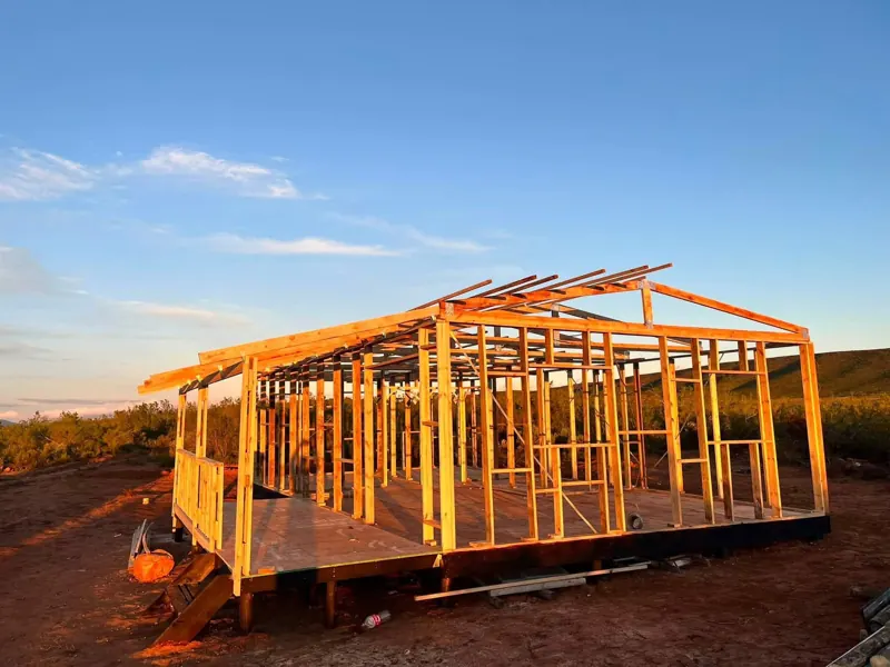 Timber wall frames standing at sunset
